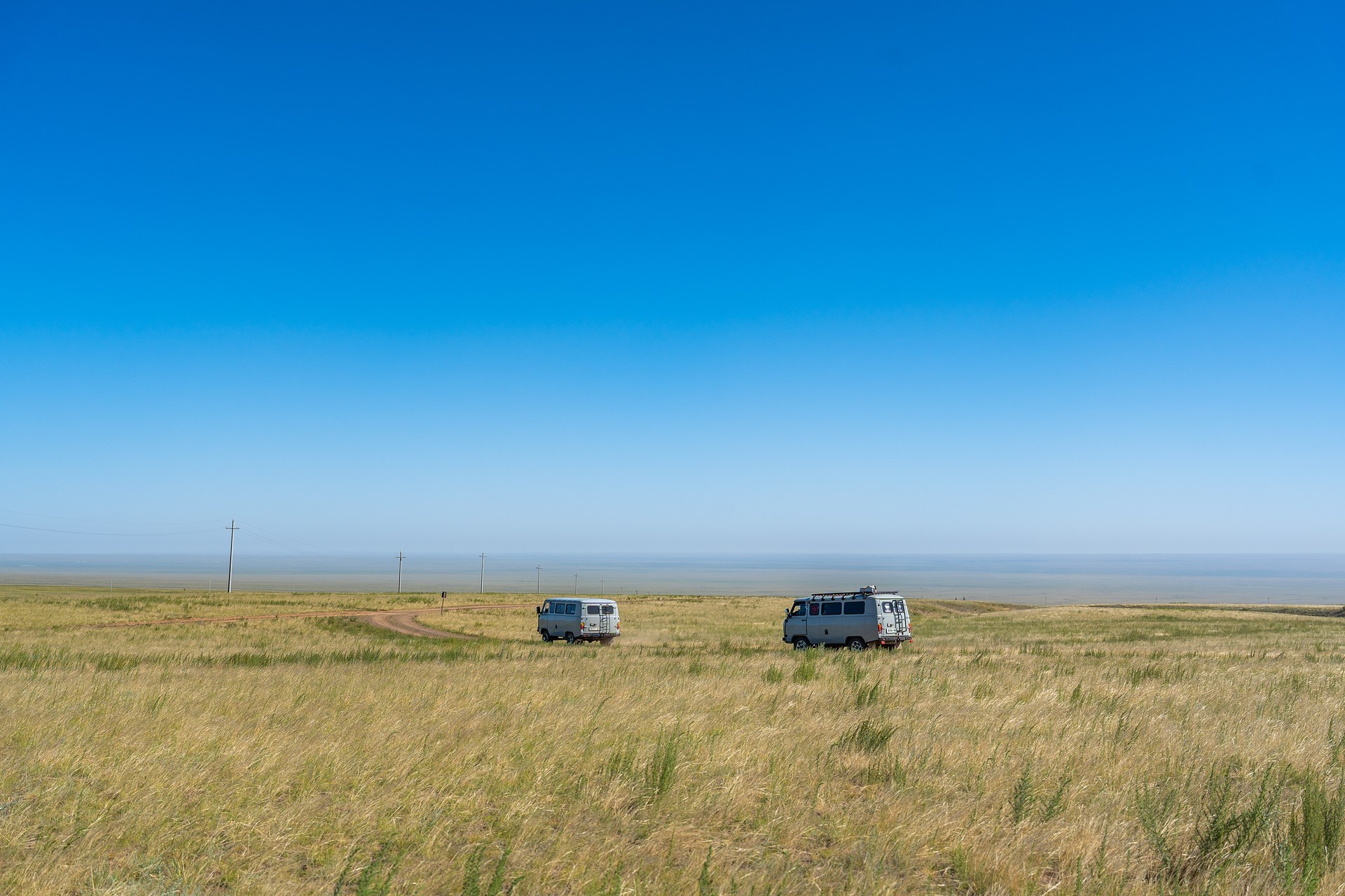 Two furgons on the meadow